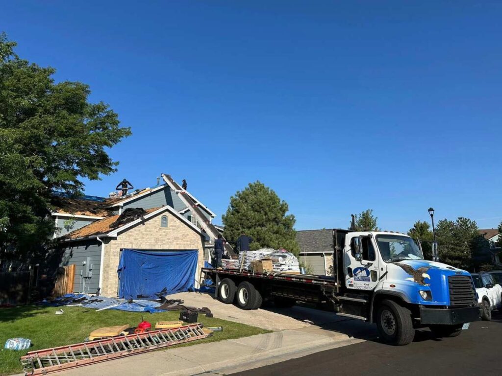 Roof repair in progress showing underlying damage found after shingles are removed