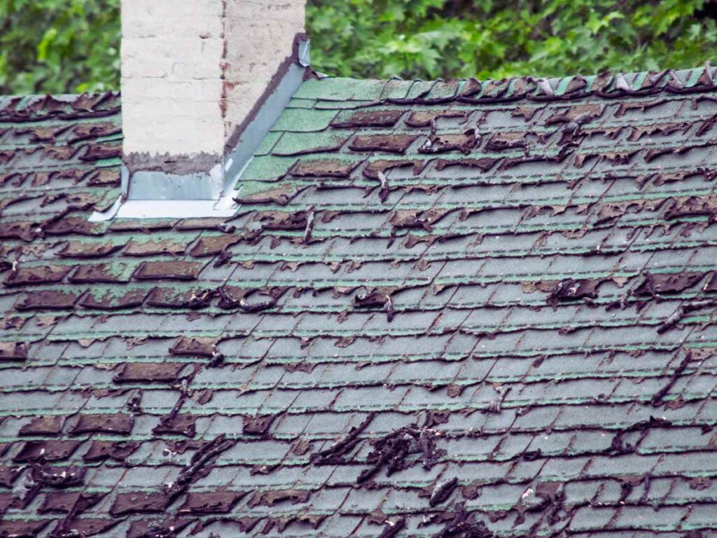 comparison of hail impact marks and natural aging on asphalt shingle roof